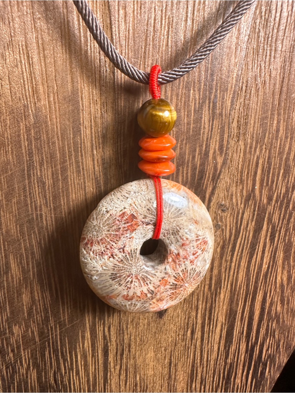 Handcrafted Red and Brown Coral Fossil Donut Pendant Necklace on Brown Rope - Picture 11 of 16